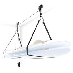 a white surfboard hanging from a hook