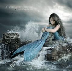 a woman with long hair sitting on top of a rock next to a blue mermaid