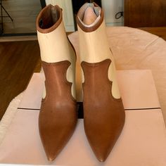 Brand New Never Worn Dolce Vita Noraya Heeled Booties Brown With Cream Canvas. Original Box Size 6.5 3.75" Heel Chic High Heel Boots With Wooden Heel, Cream Almond Toe Heels In Faux Leather, Brown Pointed Toe Heels For Spring, Brown Boots With Sculpted Heel For Spring, Chic Cream Heels For Fall, Spring Beige Faux Leather Boots, Chic Cream Pointed Toe Boots, Beige Heels With Wooden Heel And Pointed Toe, Summer Pointed Toe Boots With Wrapped Heel