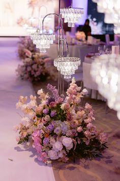 an elegant centerpiece with crystal chandeliers and flowers