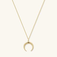 A nature-inspired crescent tusk pendant evokes an effortless bohemian vibe. The best selling Crescent Pendant Necklace is a golden staple that can be worn with any outfit, everyday, layered up or styled as a statement. - 18k gold plated- Pendant size 16.6 x 17 mm.- Adjustable chain 16 to 18 in.- 1 Year warranty Gold Moon And Star Necklace, Minimalist Gold-plated Necklace With Moon Charm, Yellow Gold-plated Necklaces With Moon Charm, Gold Tarnish-resistant Moon Necklace, Gold Moon-shaped Celestial Charm Necklace, Tusk Pendant, Crescent Moon Necklace Silver, Crescent Moon Necklace Gold, Crescent Moon Pendant