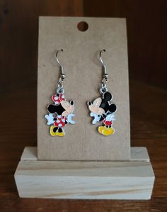 Handmade earrings with kissing Mickey and Minnie charms.  Double backings automatically included. Silver Fun Dangle Earrings, Fun Nickel-free Silver Earrings, Nickel-free Themed Dangle Earrings, Mickey Beaded Earrings, Mickey Ear Earrings, Mickey Mouse Jewelry, Mickey And Minnie Earrings, Gold Disney Mickey Mouse Jewelry, Handmade Earrings