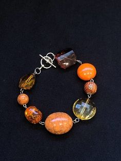 Bracelets are handmade and one of a kind. Beaded orange bracelet with crystal-like beading on silver wire backing. Bracelet is approximately 8 inches. Beaded Orange, Funky Accessories, Orange Bracelet, Glass Bead Bracelet, Bead Bracelet, Glass Bead, Silver Wire, Beaded Bracelet, Beading