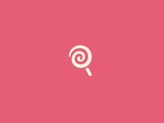 a pink background with a white lollipop in the center on top of it