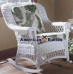 a white rocking chair sitting next to a window