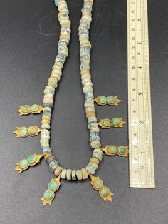 Amazing antique Roman glass beads with 20k gold and natural turquoise Gold Turquoise Necklace With Round Beads And Natural Stones, Handmade Gold Turquoise Necklace With Round Beads, Gold Turquoise Necklace With Polished Beads, Traditional Gold Beaded Necklaces With Natural Stones, Artisan Turquoise Necklace With Polished Gold Beads, Artisan Turquoise Necklace With Natural Stones In Gold, Artisan Turquoise Necklace With Gold Gemstone Beads, Artisan Gold Turquoise Necklace With Natural Stones, Artisan Gold Turquoise Necklace With Polished Beads