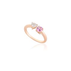 This is part of Chairish’s Fine Jewelry assortment.  Diamond Heart and Pink Sapphire Two Stone Open Ring in 18K Gold featuring natural pink sapphire of 0.38 carats and diamond of 0.34 carats. The gorgeous handcrafted ring goes with every style. Sapphire stimulates concentration and reduces stress. Designed with a heart cut diamond set on one side and round pink sapphire set on other side making a Toi et Moi ring that makes it a perfect fit to wear it on your occasion or style it with any of your Pink Diamond Ring With Diamond Accents For Promise, Pink Diamond Ring With Accents For Promise, Pink Promise Diamond Ring With Accents, Pink Diamond Sapphire Ring For Proposal, Pink Diamond Accented Promise Rings, Pink Sapphire Diamond Ring For Proposal, Pink Diamond Accents Promise Rings, Pink Promise Rings With Diamond Accents, Pink Sapphire Proposal Ring