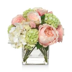 a vase filled with pink and green flowers