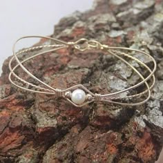 Pearl Bracelet Feminine Freshwater Pearl Gold Wire Bracelet | Etsy Wrapped Bracelets, Pearl Bracelet Wedding, Popular Bracelets, Wire Wrap Jewelry Designs, White Pearl Bracelet, Wire Jewelry Tutorial, Jewelry Staples, Wedding Bridesmaid Jewelry, Pearl Bridal Jewelry