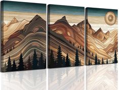 three canvases with mountains and trees painted on them