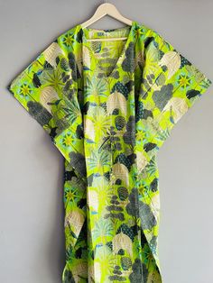 This Beautiful Indian Cotton Caftan Or Can Be Called As Tunic Is Made With Super Fine Quality Cotton And Designs Have Been Crafted By Hand Prints. Measurements :- Size - Free Size Length -138 Cm / 54 Inches Bust/Chest Size - 87 CM/ 34 Inches Fabric - 100% Cotton Pattern - Floral Kaftan Has Adjustable Drawstring Waist To Loose Or Tight , Kaftan Has V Shape Neck Which Is 8" Inches Deep. Kaftan Is Multi-Purpose And Can Be Worn As A Cover Up At The Beach ,Lounge Wear ,Sleepwear ,Pregnant Women Hospital Gown For Newly Moms ,Maxi Dress ,Free Dress Etc . Indian Kaftan Very Comfortable To Wear In Both Hot Or Cold Weather. Kaftan Is Super Comfortable .It Will Be Loose And Free Flowing And Fabric Is Very Soft With Vibrant Color Note :-Due To Different Monitor Setting Colors May Be Little Vary To Ori Green Hawaiian V-neck Dress, Green Printed V-neck Kaftan, Green V-neck Printed Kaftan, Green Short Sleeve Tunic For Vacation, Green V-neck Tunic For Beach, Green V-neck Free Size Kimono, Patterned V-neck Kaftan For The Beach, Green Free Size Kimono With Kimono Sleeves, Green Kimono With Kimono Sleeves