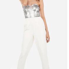 A Flattering Fit And Sequins That Steal The Show - This Extravagant Sweetheart Jumpsuit Is A Must-Have For All Your Upcoming Parties And Events. Features & Fabric Embellished Sequin Bodice Hidden Side Hook And Zip Closure Strapless Jumpsuit; Sweetheart Neckline Polyester/Spandex Imported Hand Wash Slant Hand Pockets; Straight Hem Party White Sequined Jumpsuits And Rompers, Elegant Strapless Jumpsuit With Sequins For Night Out, Glamorous Strapless Jumpsuits And Rompers For Date Night, Elegant Strapless Sequin Jumpsuit For Night Out, White Jumpsuits And Rompers For Party Season, White Jumpsuits And Rompers For Party, Glamorous Strapless Sleeveless Jumpsuit For Cocktail, Glamorous White Sequined Jumpsuits And Rompers, White Fitted Strapless Jumpsuit For Party