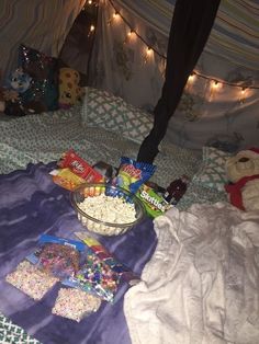 the bed is covered with candy and candies