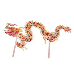 two colorful dragon shaped toothpicks sitting on top of each other in front of a white background