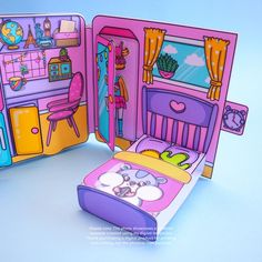 an open children's book with a cartoon bedroom scene