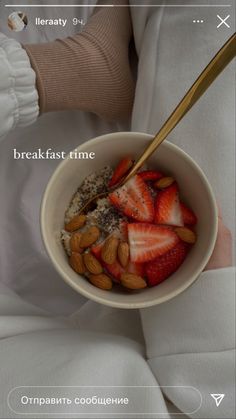 a bowl of oatmeal with strawberries and almonds