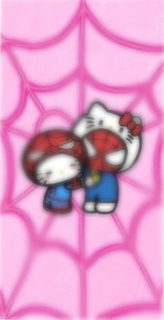 the hello kitty character is standing in front of a spider web