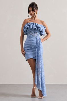 Look out of this world this wedding season in our Neptune, our aptly-named mini dress. Designed in a soft blue shade of our premium crepe, this figure-hugging piece has been carefully wrapped in a delicate lace overlay and features a ruffled neckline, boned bodice and elegantly gathered skirt. Complete with a free flowing drape, whats not to love with Neptune? Features - Premium stretch crepe - Lace overlay- Ruffled bandeau neckline - Boned bodice- Invisible zip closure- Gathered skirt- Floor-length drape- Mini length Sizing & Fit Model is 5'7 and wears UK size 8 / US size 4Product Information Designed exclusively by Club L London Partially layered with good stretch Premium crepe & lace in Blue (47% Polyamide, 36% Cotton, 17% Viscose) Lining (96% Polyester, 4% Elastane)85cm total dress len Dress With Drape, Ruffled Mini Dress, Boned Bodice, Black Dress Prom, Black Tie Gala, Ruffled Neckline, Party Dress Long Sleeve, Lace Strapless, Bridesmaid Outfit