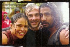 two men and a woman are posing for a photo with the caption in front of them