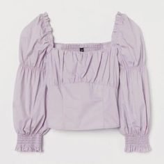 *Never Worn* Divided | H&M Cotton Puff Sleeve Lilac Blouse. Blouse In Airy, Woven Cotton Fabric. Square Neckline At Front And Back, Smocking At Back, And Seam Below Bust. Narrow, Ruffle-Trimmed Elastic Over Shoulders, 3/4-Length Puff Sleeves With Narrow Elastic At Upper Section And Wide Smocking At Cuffs. Jersey Lining At Front. #Boho #Modern #Puffsleeve #Spring #Croptop Tags - Brandy Melville Tobi Pacsun Peppermayo Mura Xenia Showpo Lf Urban Outfitters Forever 21 Asos Boohoo Hm Zara Missguided Summer Tops With Lantern Sleeves And Gathered Details, Chic Purple Puff Sleeve Blouse, Daywear Padded Blouse With Lantern Sleeves, Daywear Padded Lantern Sleeve Top, Padded Lantern Sleeve Blouse For Daywear, Casual Purple Puff Sleeve Tops, Fall Tops With Gathered Sleeves And Square Neck, Square Neck Tops With Gathered Sleeves For Fall, Square Neck Tops With Gathered Sleeves For Daywear