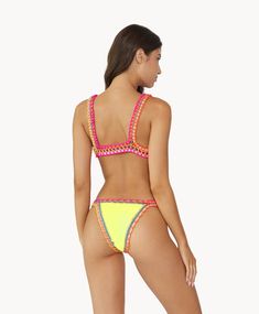 This crochet bikini features exposed elastic detailing that adds a touch of vintage charm and stretchy fabric that ensures a comfortable and flattering fit for all body types. Our famous retro-inspired bright yellow crochet bikini produced in collaboration with original female Brazilian designer, Solange Ferrarini. Stretch Swimwear With Crochet Trim For Pool, Stretch Crochet Trim Swimwear For Pool, Beachwear Swimwear With Crochet Trim For Pool, Stretch Beachwear Swimwear With Crochet Trim, Stretch Beachwear With Crochet Trim, Triangle Top Swimwear With Crochet Trim, Stretch Crochet Trim Triangle Swimwear, Stretch Crochet Trim Triangle Top Swimwear, Summer Swimwear With Crochet Trim And Stretch Fit