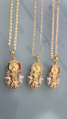 "Special for you. We offer free shipping with the purchase of 35 dollars or more! with First Class Mail (Not Priority Mail) Virgin Mary (Guadalupe Virgin) with Roses Necklace - Two Style Gorgeous Virgen de Guadalupe Pendant with Rose flowers surrounding her heavenly image! *Pendant Height: 2.75\" inches *Pendant Width: 1\" inch *14k Tricolor Gold Plated *Includes 24\" inches 5mm Figaro and Curb chain Material: Copper Measurements: Chain - 12 inch. from top to bottom (24\" Long from end to end) * Mexico Jewelry, Gold Mexican Jewelry, St Jude Necklace, Big Pendant Necklace, Latina Jewelry, Xoxo Jewelry, Virgin Mary Necklace, Pendant Necklace Simple, Princess Jewelry