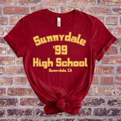 Our Buffy The Vampire Slayer Tee is a great gift for any fan of the show! The comfortable fit and cool design of this Sunnydale High shirt means that it feels just as good to wear as it is to look at. If you've been looking for a Sunnydale Razorbacks T-Shirt or a tee to show your Buffy, Angel, Spike or Willow pride you should get this Sunnydale Highschool shirt today. Bella + Canvas Brand Shirt ▶Unisex Adult Sizing ▶See Our Size Chart For Proper Sizing ▶Rolled sleeves are for styling purposes on Halloween Fandom Tops For Fan Merchandise, Halloween Fandom Fan Merchandise Tops, Sunnydale High School, Buffy Angel, Vampire Shirt, Slayer Shirt, The Gentlemen, Rolled Sleeves, Buffy The Vampire