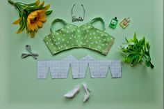 sewing supplies laid out on a green surface with sunflowers and other things to sew