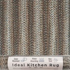 the ideal kitchen rug in brown and blue is shown with an adhesive sticker