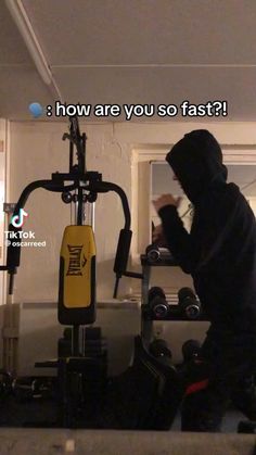 a man in a black hoodie is doing exercises on a stationary exercise machine with the words shadow boxing with weights