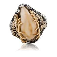 Sterling Silver & 14K Yellow Gold Elk Ivory Ring with Double Elk Head Fine detail and bold craftsmanship are beautifully displayed in this elk ivory ring which is hand carved and custom designed for you by Park City Jewelers. Your elk's tooth will be perfectly and carefully fitted and securely set amid elk antlers with your choice of all 14K yellow, 14K white gold with 14K yellow gold antlers, or sterling silver. This elk's tooth trophy ring is created for your magnificent trophy elk's tooth as Grad Rings, Elk Ivory Ring, Deer Horn Jewelry, Elk Ivory Jewelry, Elk Ivory, Elk Head, Ivory Jewelry, Antler Carving, Tooth Ring