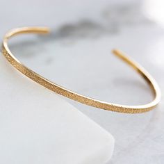 "Add the perfect subtle statement to your outfit with our Diamond Dusted Narrow Cuff. Combining the design of our favorite bracelet with our diamond dusted texture, this cuff adds the perfect amount of sparkle to your every day. We love stacking our diamond dusted narrow cuff with a narrow inspiracelet cuff https://www.etsy.com/listing/215740033 . For added impact, wear with the diamond dusted grand cuff https://www.etsy.com/listing/912024415 . details + narrow cuff measures 2.25 mm wide + handm Bracelet Diamond, Inspirational Bracelets, Dust Collection, Bracelet Sterling Silver, Girly Jewelry, Adjustable Necklace, Diamond Bracelets, Adjustable Bracelet, Sterling Silver Bracelets