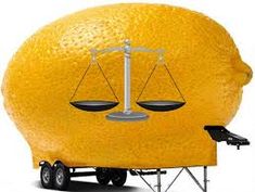 a large orange with scales on it's face as a balance between two wheels