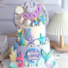 a three tiered cake decorated with sea life