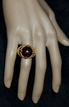 GORGEOUS VINTAGE ITALIAN DESIGN 18K YELLOW GOLD GARNET RING CENTER NATURAL RED GARNET IN ROUND CABOCHON SHAPE WEIGHT 9.57CARAT SIZE 14.5 GORGEOUS RED GARNET CLEAN ,VERY NICE CUT ,LIVELY STONE.NICE LUSTER. RING size 7.5 Ring weighs 12.7 grams Retail value $7,500 net . Appraisal available Timeless Gold Dome Ring With Cabochon, Gold Ruby Ring With Domed Shape, Gold Domed Ruby Ring With Gemstone, Luxury Gold Dome Ring With Cabochon, Classic Ruby Ring With Round Stone For Formal Occasions, Elegant Round Cabochon Ruby Ring, Formal Cabochon Ruby Ring, Red Round Rings For Formal Occasions, Classic Gold Ruby Cabochon Ring