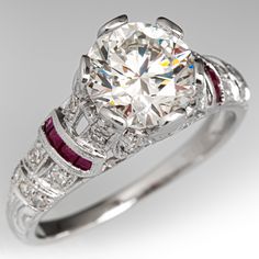 This beautiful contemporary Art Deco style platinum diamond and ruby accented mounting holds an IGI certified lab grown diamond that grades F in color and VS1 in clarity with an excellent cut grade. The ring is currently a size 7.25. EraGem lab diamond rings will arrive with an in-store certification as well as the IGI report and a lovely EraGem logo presentation box. Classic Gia Certified Diamond Ring With Lab-created Ruby, Lab-created Ruby Diamond Ring With Brilliant Cut, Brilliant Cut Lab-created Ruby Diamond Ring, White Ruby Rings With Brilliant Cut, Classic Round Cut Lab-created Ruby Diamond Ring, Lab-created Ruby Wedding Ring With Center Stone, Luxury Diamond Ring With Lab-created Ruby Accents, Classic Diamond Ring With Lab-created Ruby Accents, Lab-created Ruby Diamond Ring With Round Cut