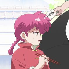 an anime character with pink hair holding chopsticks and looking at something in her hand