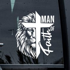 a sticker on the side of a car with a cross and lion's head