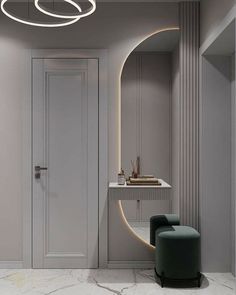 a modern bathroom with marble flooring and white walls, along with a round mirror on the wall