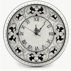 an ornate clock with roman numerals is shown on a white background in this image