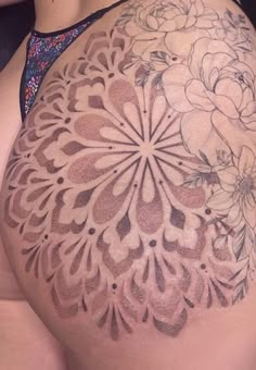 a woman's back with flowers on it