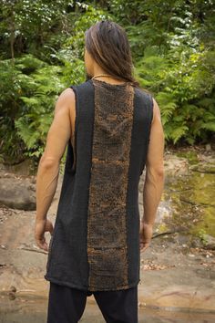 Our AKAU shamanic tank top features intricate block-printed shipibo tribal patterns that are hand-applied, giving each shirt a unique and authentic touch. Made from 100% natural cotton, and coloured with natural dyes, this tank top is fashionable and environmentally friendly. Natural fibres are biodegradable and have a lower impact on the environment compared to synthetic materials. In addition to being good for the planet, the natural cotton fabric is also breathable and comfortable to wear. Th Bohemian Sleeveless Festival Tank Top, Bohemian Sleeveless Tank Top For Festival, Cotton Sleeveless Vest For Festival, Bohemian Brown Vest Top, Brown Sleeveless Bohemian Top, Brown Sleeveless Hippie Top, Black Cotton Beach Vest, Hippie Sleeveless Cotton Vest, Black Bohemian Tank Top