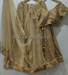 Indian wedding lehenga with embroidered blouse & dupatta for women. * Plus size available at a small up-charge. * Size: This is custom made outfit as per your size. Post your order we will send you a measurements reference sheet using which you can provide details required to make your outfit with best fit. * Fabric and work: Lehenga - Antique gold sequine fabric with very good quality lining and lace border. Blouse - Sequins fabric. Dupatta - Dupatta is in gold net with embroidery lace border o Gold Lehenga With Mirror Work For Designer Wear, Designer Gold Lehenga With Mirror Work, Festive Gold Lehenga With Mirror Work, Gold Sequined Sharara For Wedding, Gold Lehenga With Mirror Work For Reception, Gold Lehenga Saree With Mirror Work, Traditional Drape Gold Sharara With Sequins, Gold Sharara With Sequins In Traditional Drape, Gold Sharara With Sequins And Traditional Drape