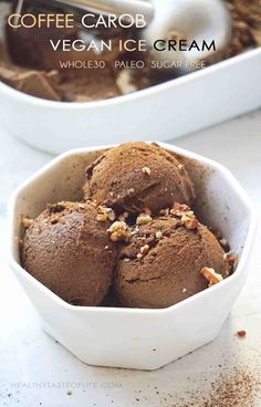 two bowls filled with chocolate ice cream on top of a table