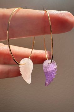 Darling, dainty, mis-matched angel wing hoop earrings. One wing is rose quartz and the other is amethyst. These are so fun, sweet and whimsical💖💜 The wings are dainty and light at .75 inches in length. Total Length of the Earring: 2 inches The hoops are gold plated and nickel free. Metaphysical Properties: Rose Quartz is said to promote love, self-love, and emotional healing. Amethyst is said to provide spiritual protection, inner strength, clarity of mind, and stress relief.  This is the perf Spiritual Protection, Rose Jewelry, Jewelry Studio, Quartz Rose, Inner Strength, Emotional Healing, Jewelry Earrings Hoops, Angel Wings, The Cutest