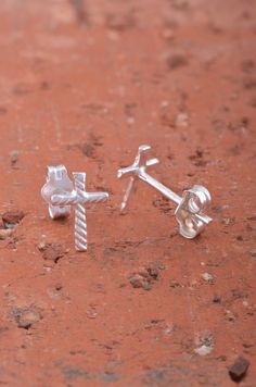 Express your faith with the elegant Sterling Silver Ladies Dainty Christian Cross Stud Earrings. Crafted from high-quality 925 sterling silver, these beautiful earrings feature a classic Christian cross design, symbolizing faith and devotion. Measuring 8mm in width and 5mm in length, these dainty stud earrings are the perfect size for adding a subtle yet meaningful accent to any outfit. The timeless cross design, combined with the brilliance of sterling silver, makes these earrings a versatile a Silver Cross Stud Earrings, Cross Stud Earrings, Cross Earrings Studs, Dainty Studs, Christian Cross, Small Crosses, Cross Design, Cross Designs, Beautiful Earrings