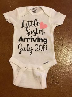 a baby bodysuit that says little sister arriving july 2019