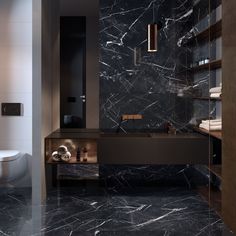 a bathroom with black marble floors and walls