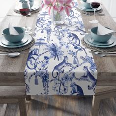 the table is set with blue and white china