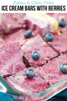 blueberry cheesecake in a glass baking dish with slices cut out and ready to be eaten